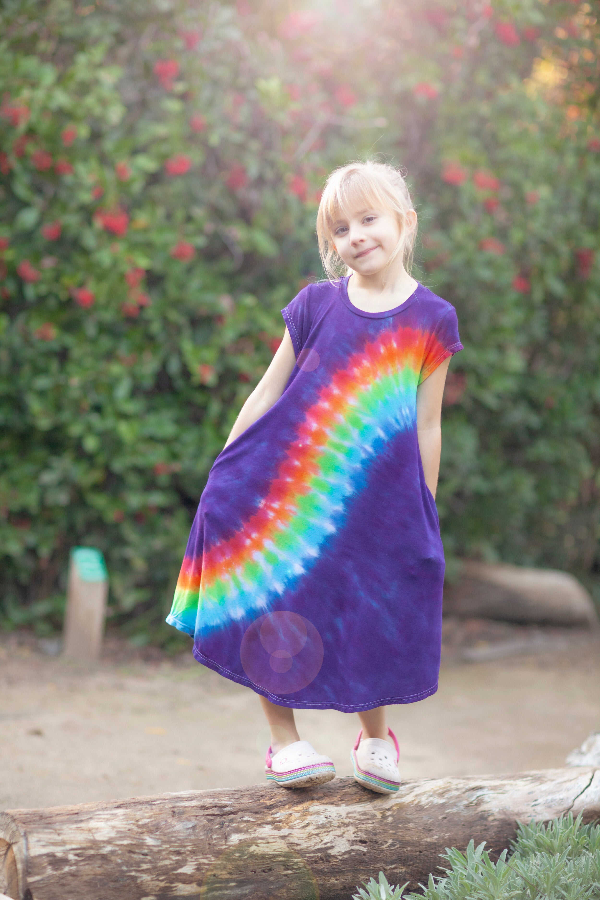 smiling girl in rainbow sensory dress