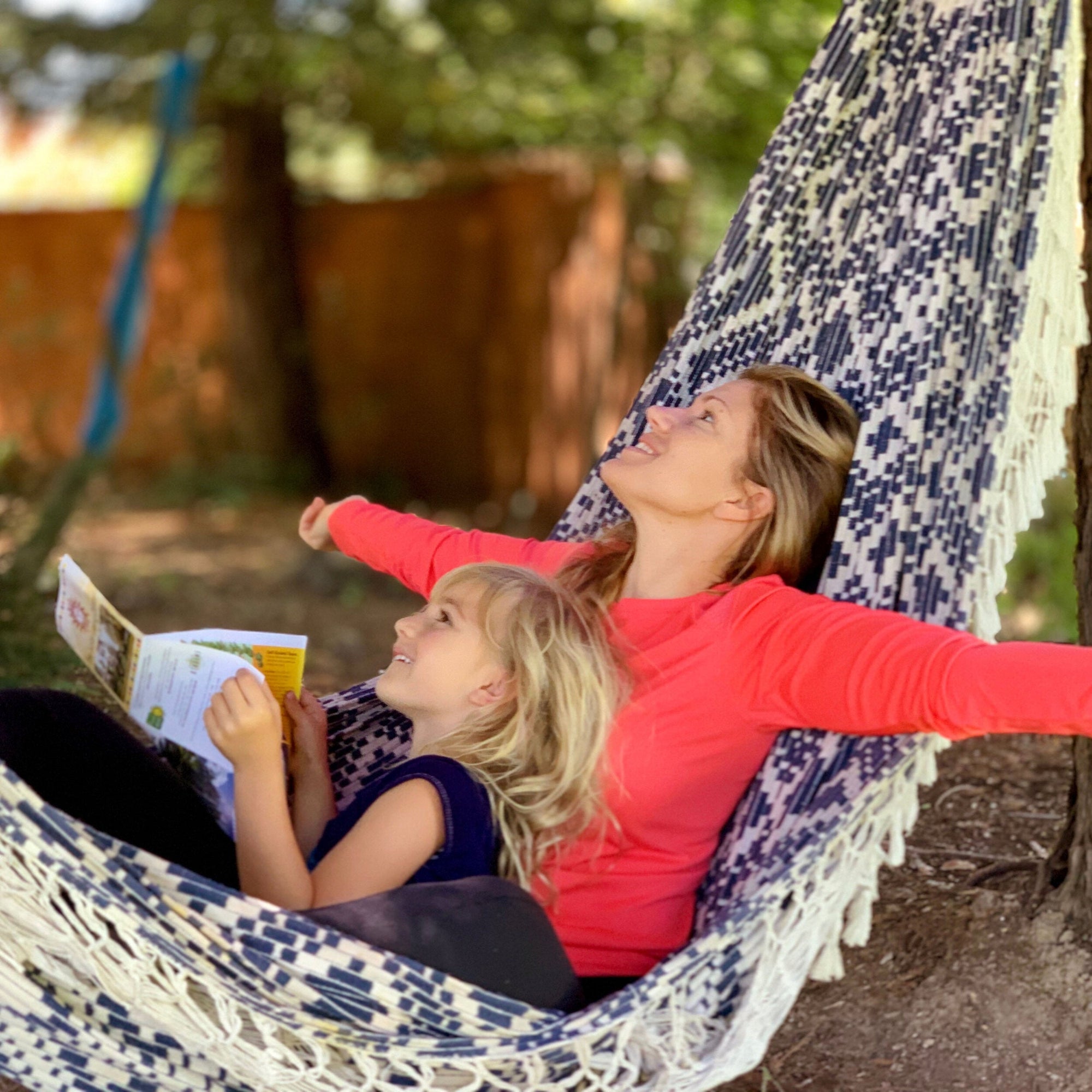 mom and child in hammock with book